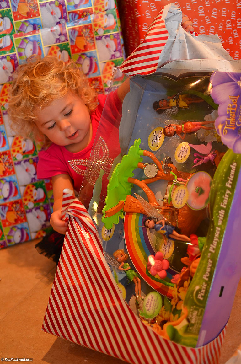 Katie opens a box bigger than herself. 