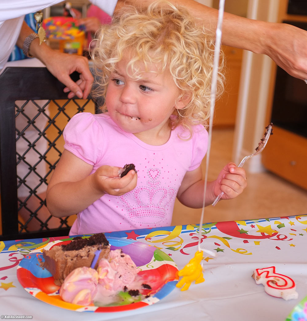 Katie looking at Ryan eating his cake