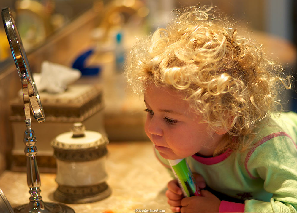 Katie wakes up, and explores her vanity counter. 