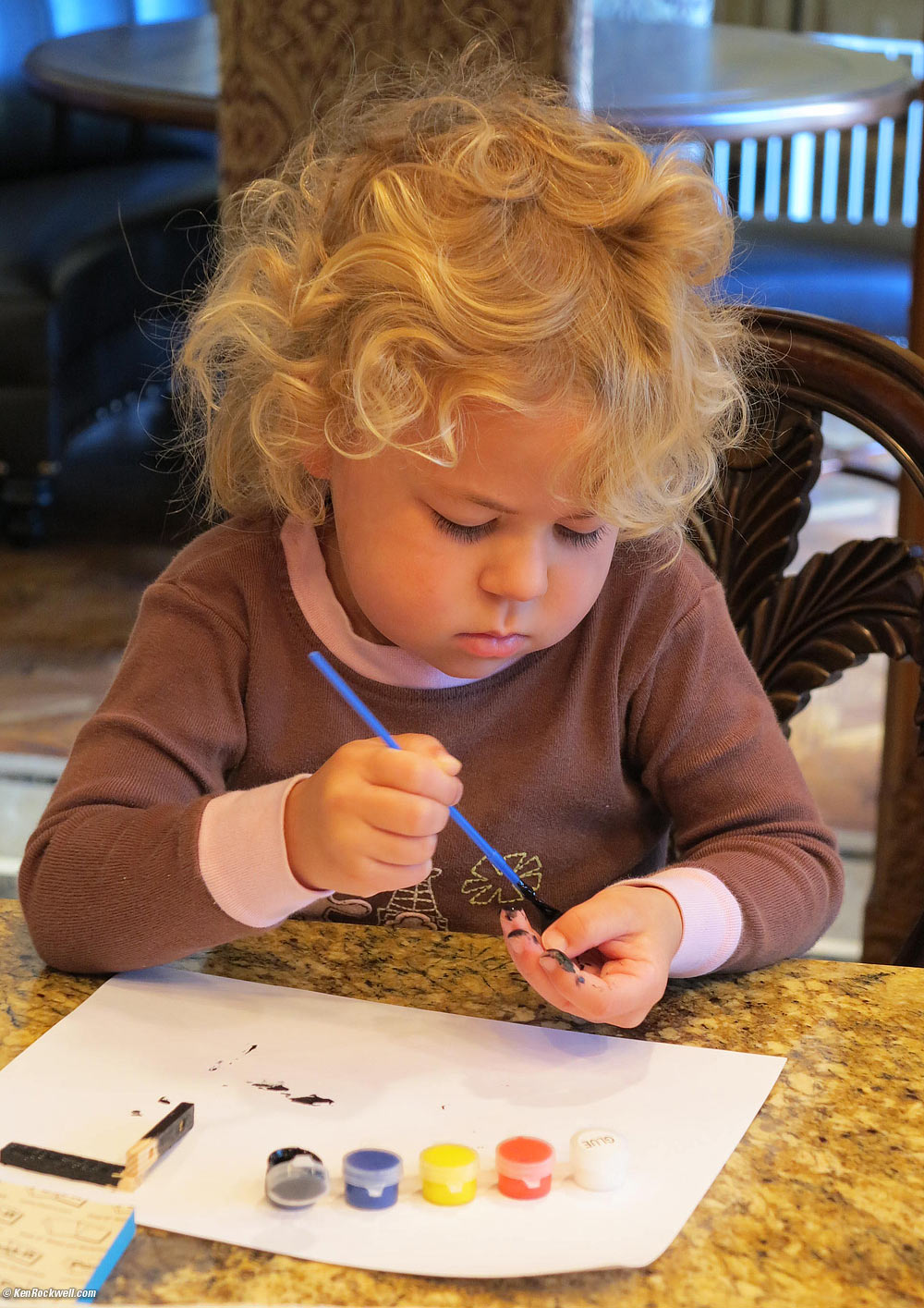 Katie painting her helicopter model.