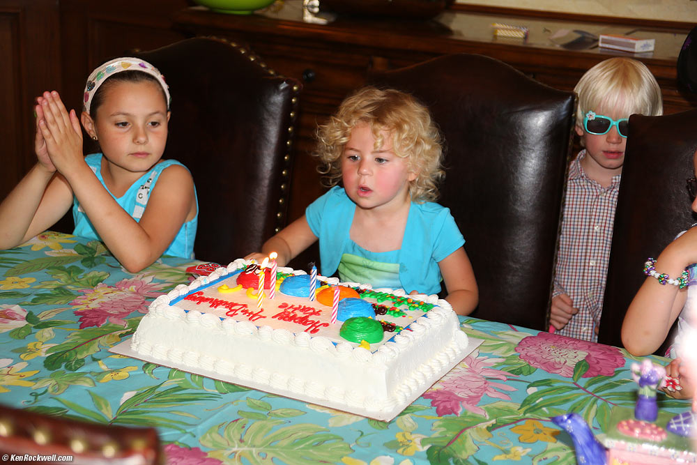 Katie blowing out her birthday cake. 