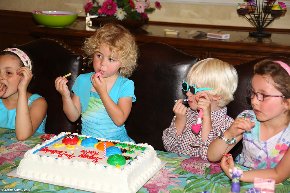 Katie licking icing off of her candles.