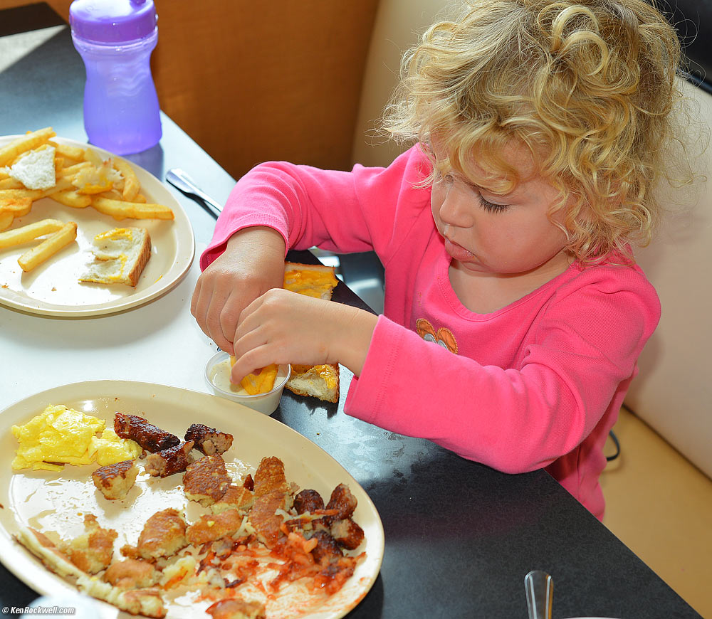 Katie takes the cheese off the grilled cheese sandwhich and dips it in ranch dressing