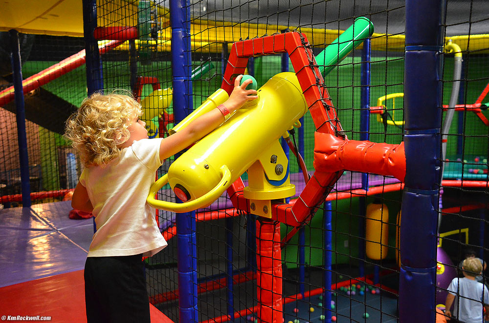 Katie loads the ball gun.