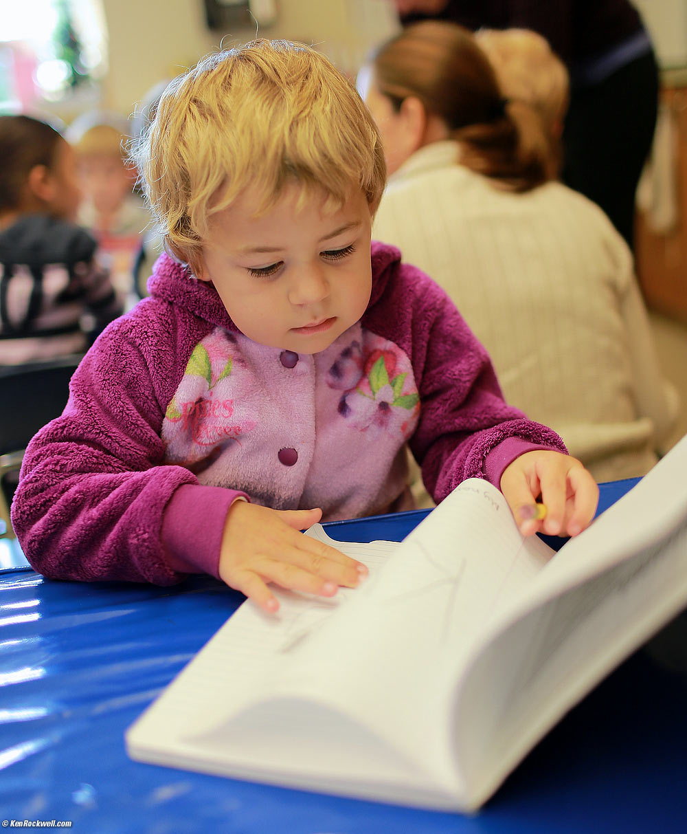 Katie reviewing her notebook at school.