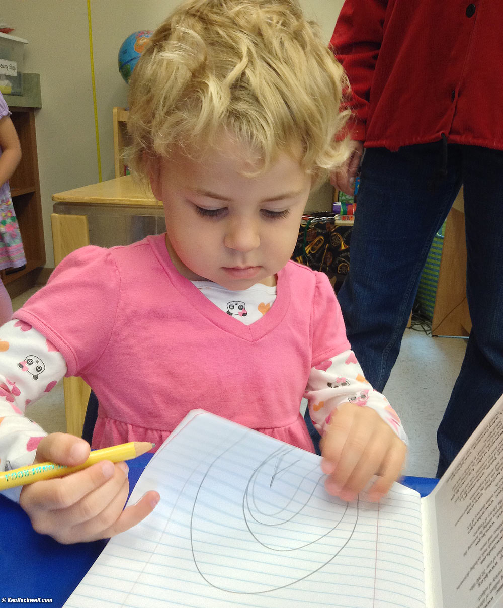 Katie drawing a rainbow