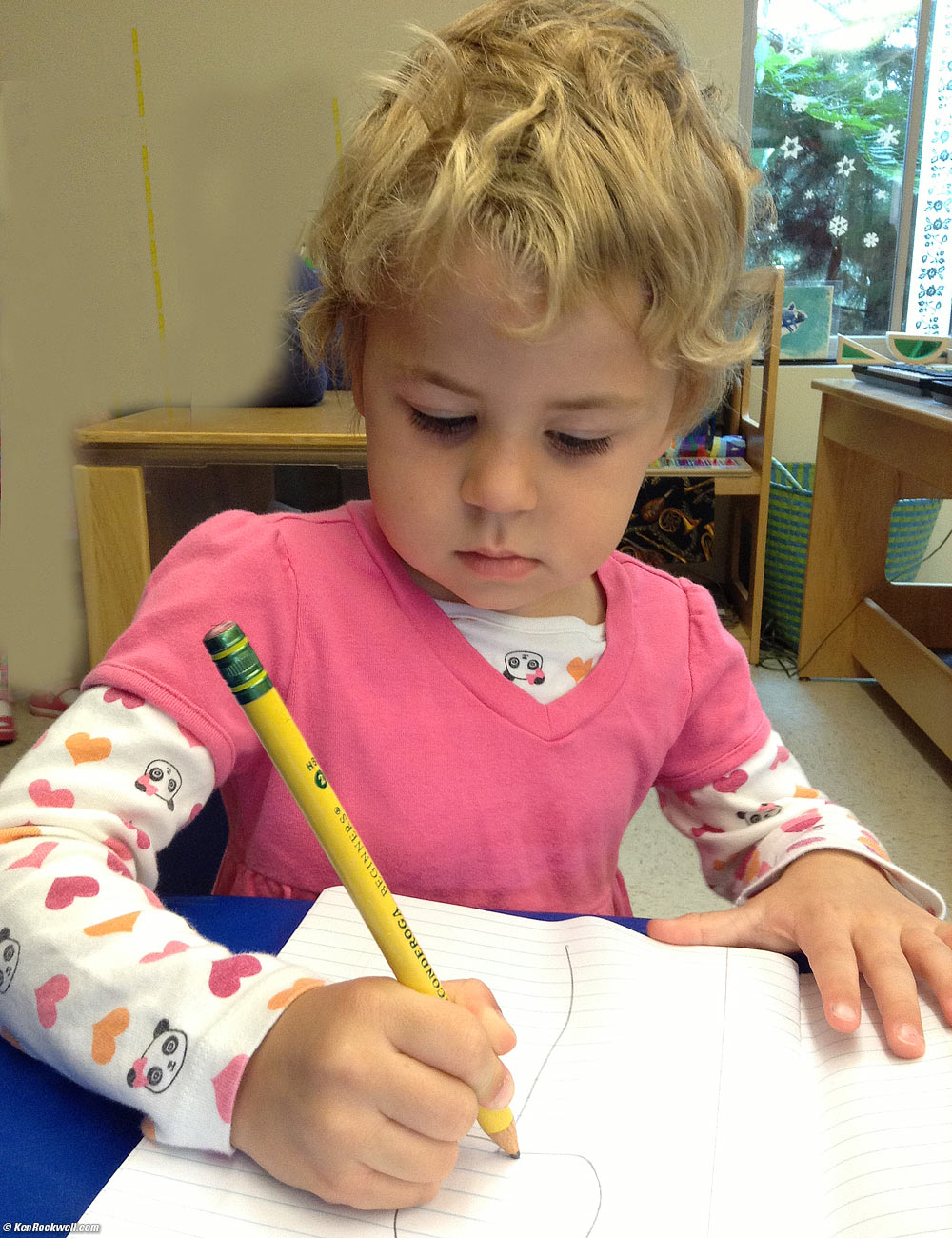 Katie drawing a rainbow