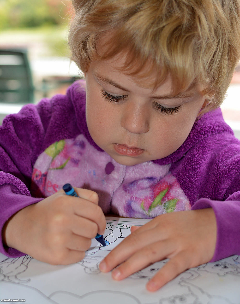 Katie coloring at Pollos Maria. 