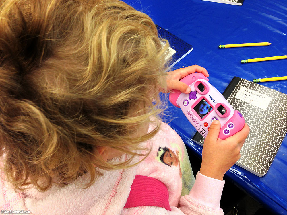 Katie brings her camera to school.
