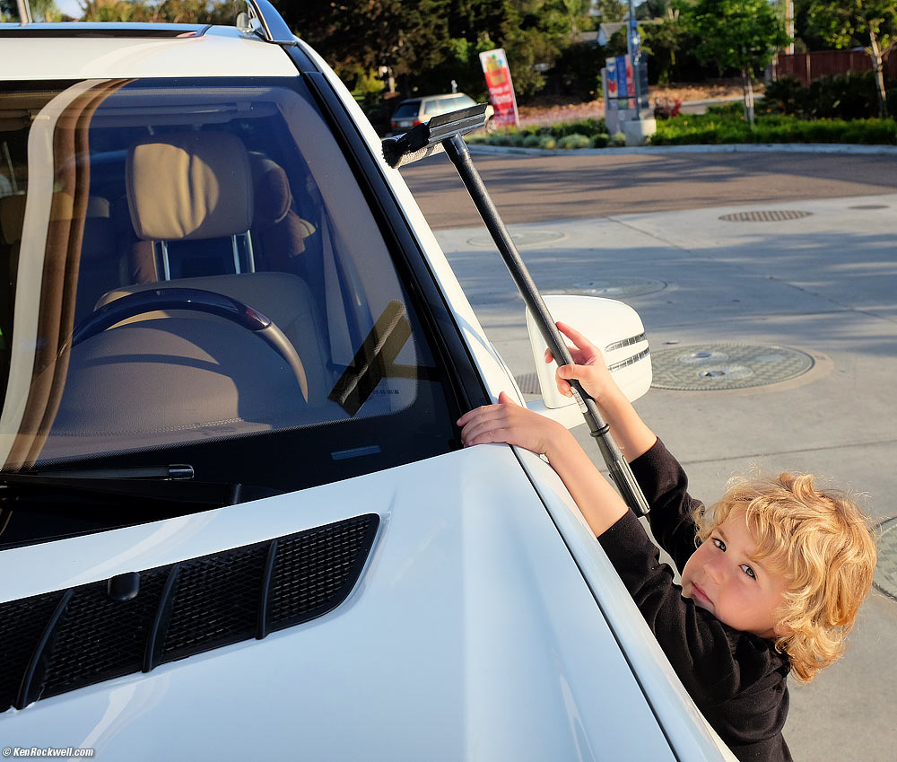 Katie washes Stomper's windshield.