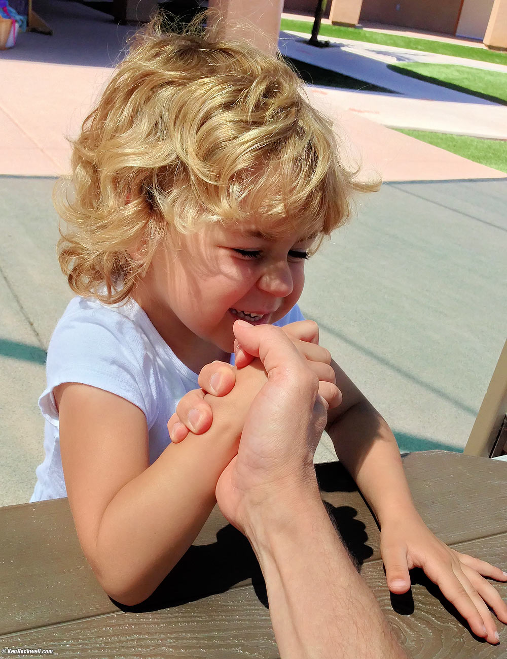 Katie beats Dada at arm wrestling