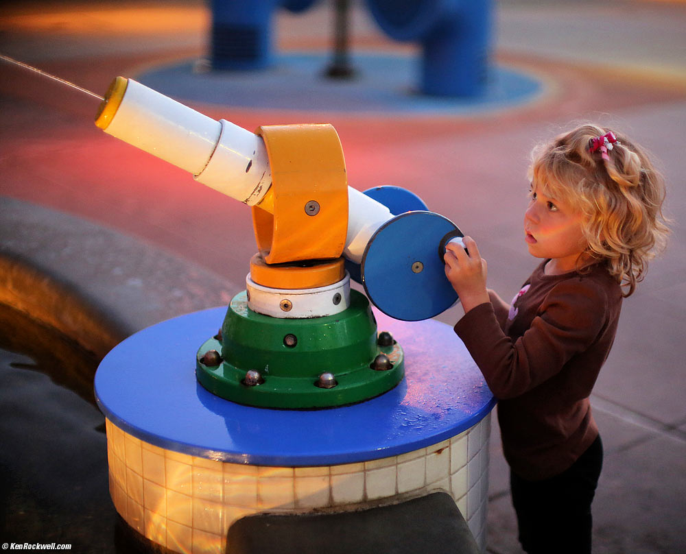 Katie slides down the pole
