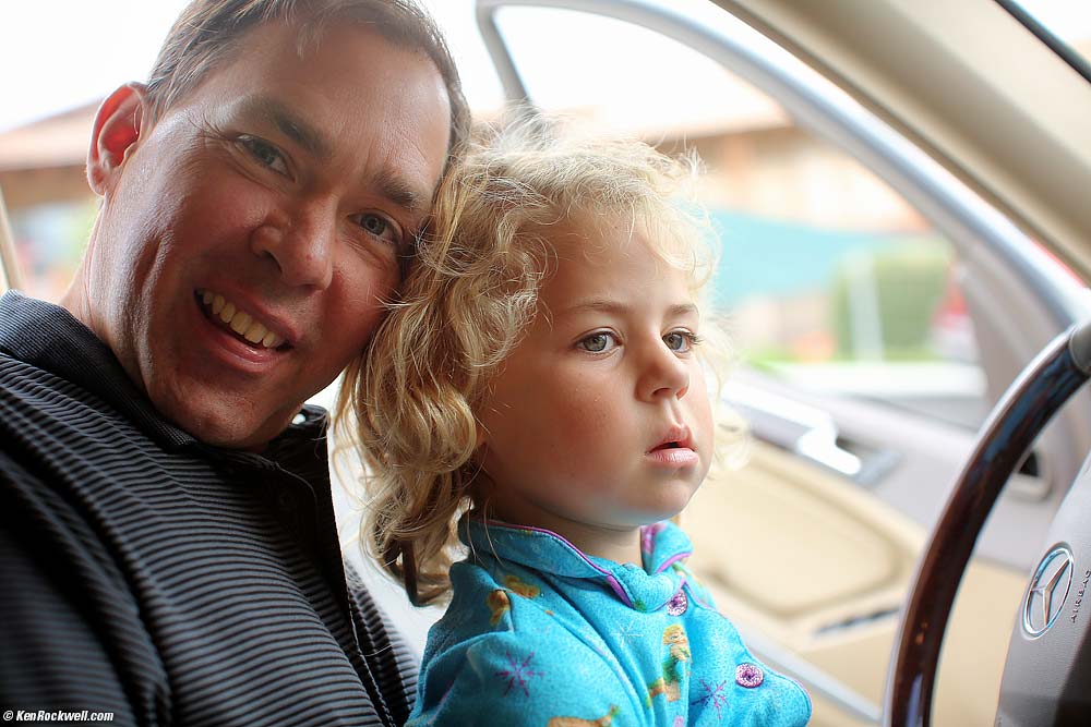 Katie driving Stomper from Dada's lap.
