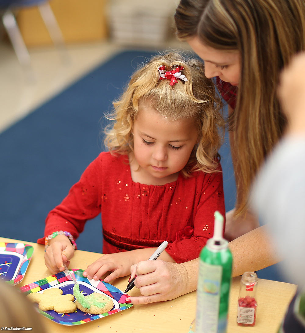 Katie making a cookie at the party in her classroom after the concert