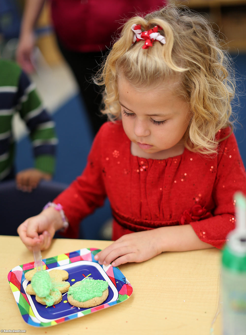 Katie making a cookie at the party in her classroom after the concert