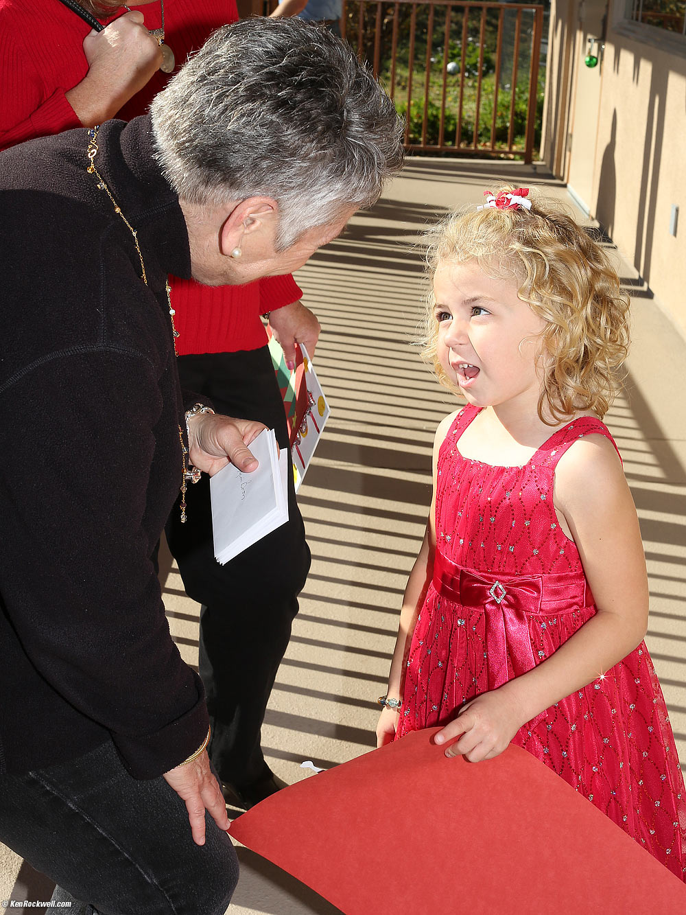 Katie discusses her elf art with Miss Cindy