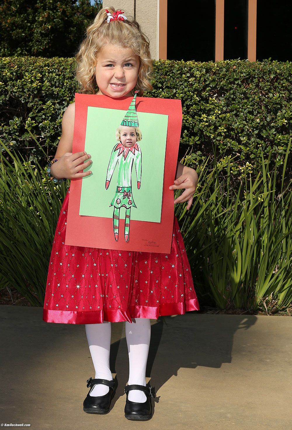 Katie makes the same face as she has on her elf art.