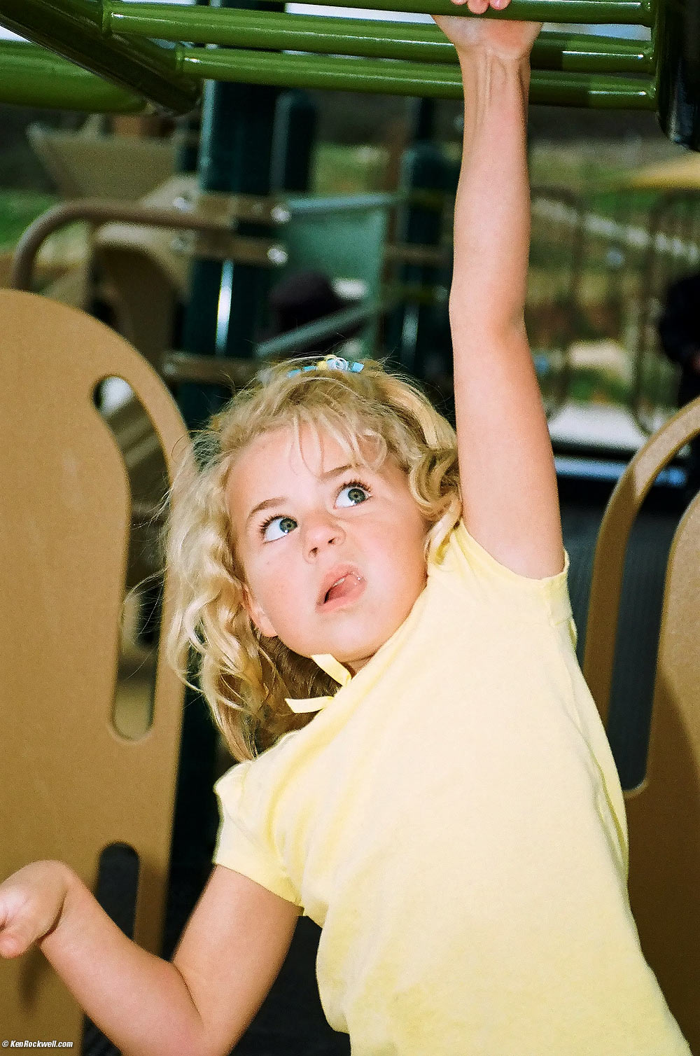 Katie on the high bar at the new park. 