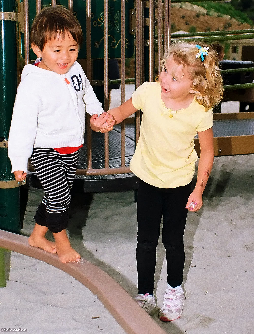 Katie on the high bar at the new park.