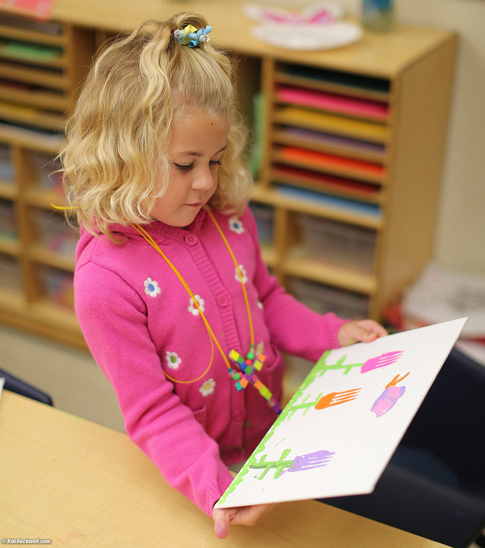 Katie inspects her painting