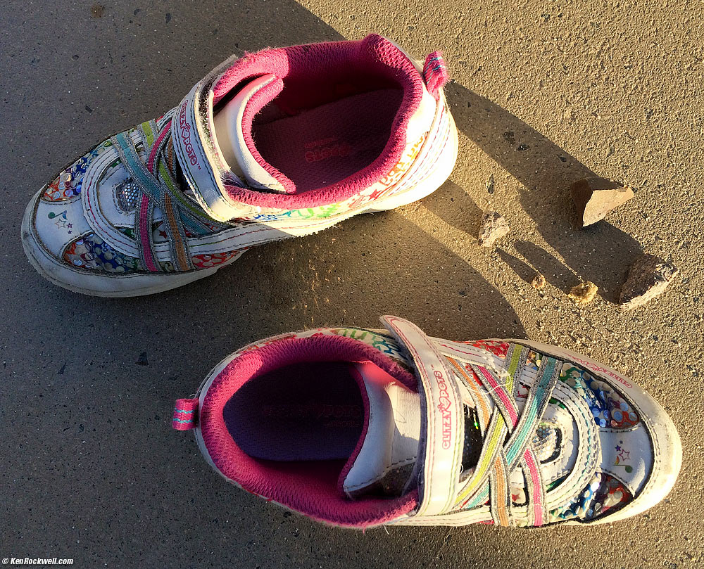 Katie's shoes at the park, with her found treasures