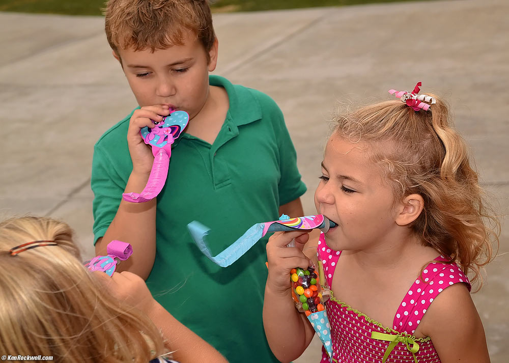 Katie and Ryan and party noisemakers