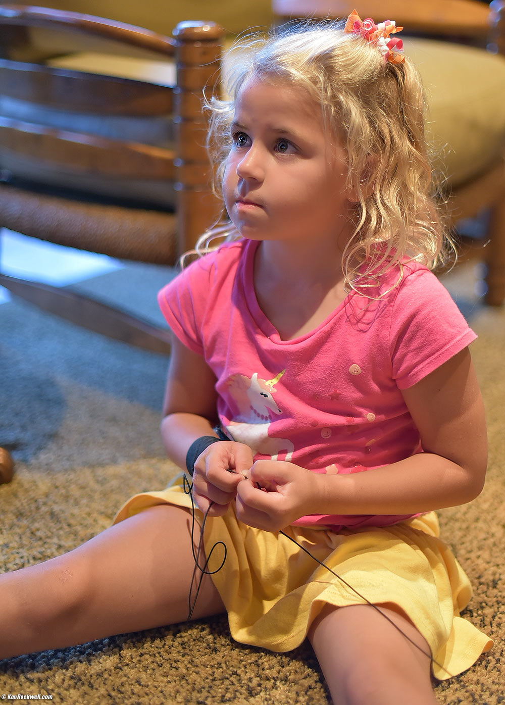 Katie plays with the small basketball on elastic that Ryan won at the pumpkin station &ndash;&nbsp;but didn't want