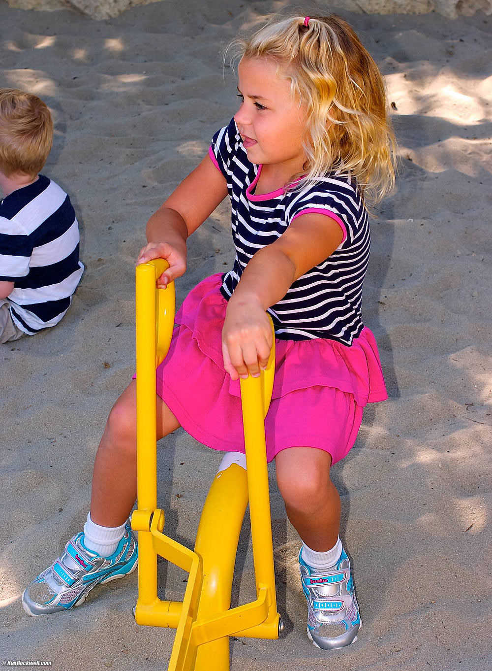 Katie digging at the dinosaur park.