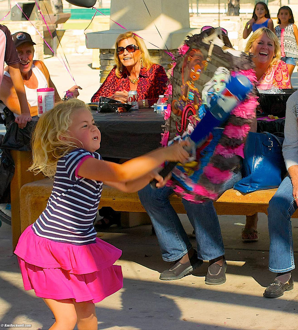 Katie slams the pi&ntilde;ata.