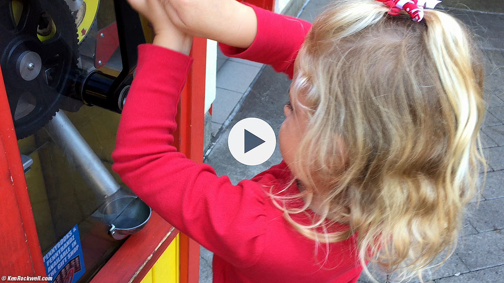 Katie and the penny machine at Legoland. 