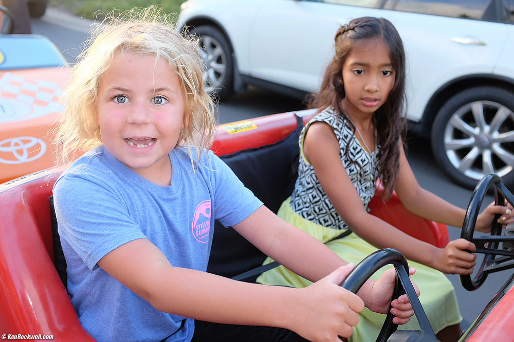 Katie makes a funny smile at Neal's party
