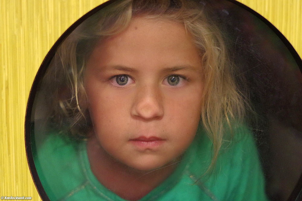 Katie behind glass at the dentist's office