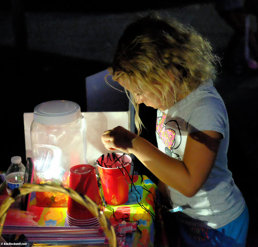 Katie shops for necklaces in the park