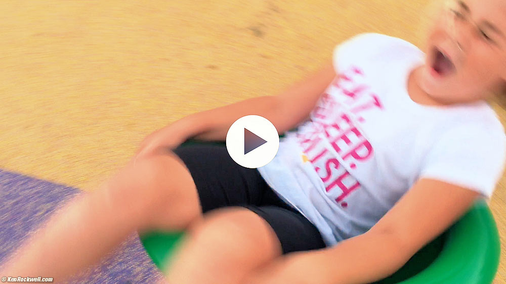 Katie spinning around at the park