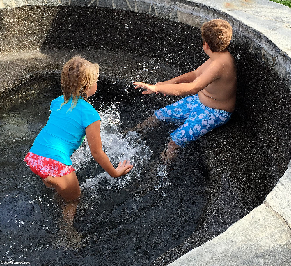 Katie splashing Ryan in a dry spa