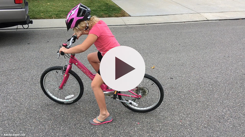 Katie learns to ride a two-wheelie bike for the first time