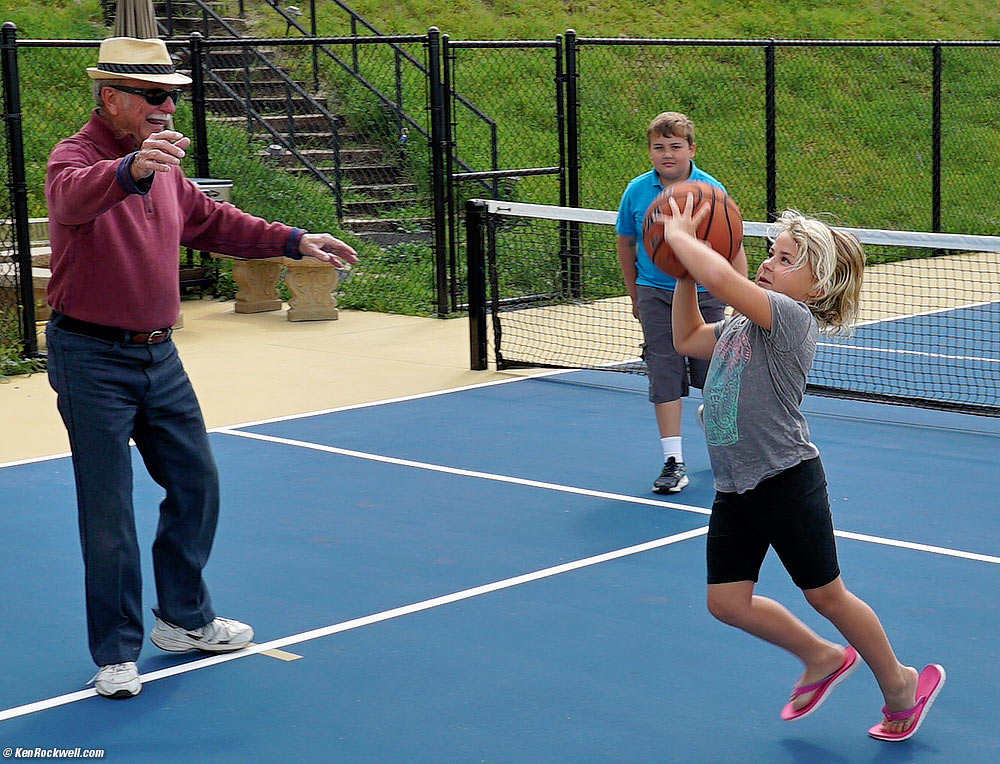 Pops, Ryan and Katie playing basketball.