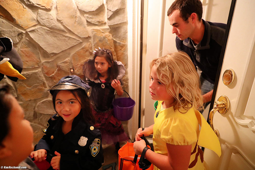 Ryan's penguin nose, Mia, Stella and Katie trick-or-treating