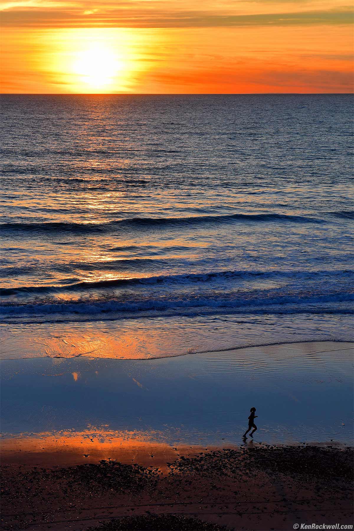 Sunset at the beach with runner
