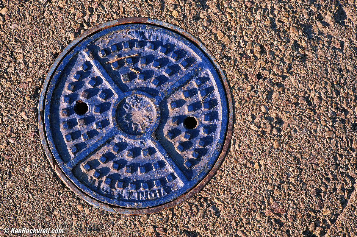Blue manhole cover