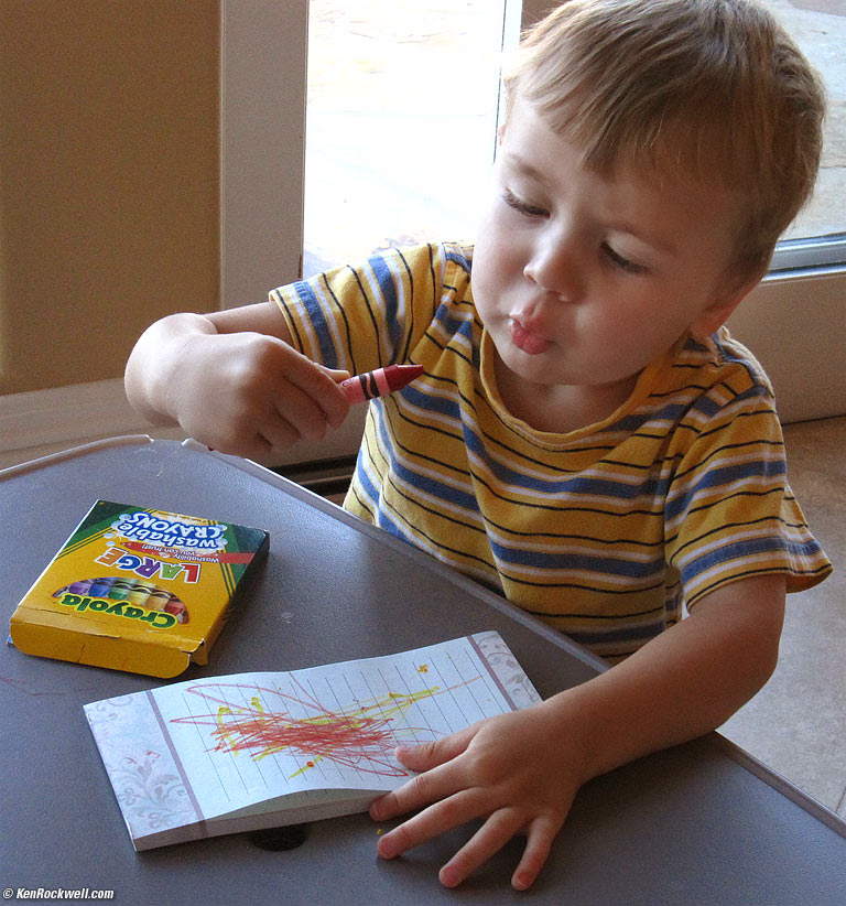 Ryan blowing on crayon