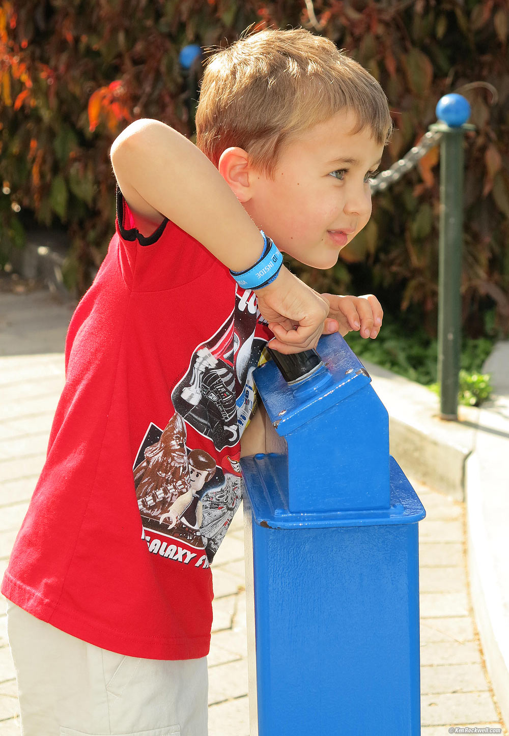 Ryan pressing the button by the water ride