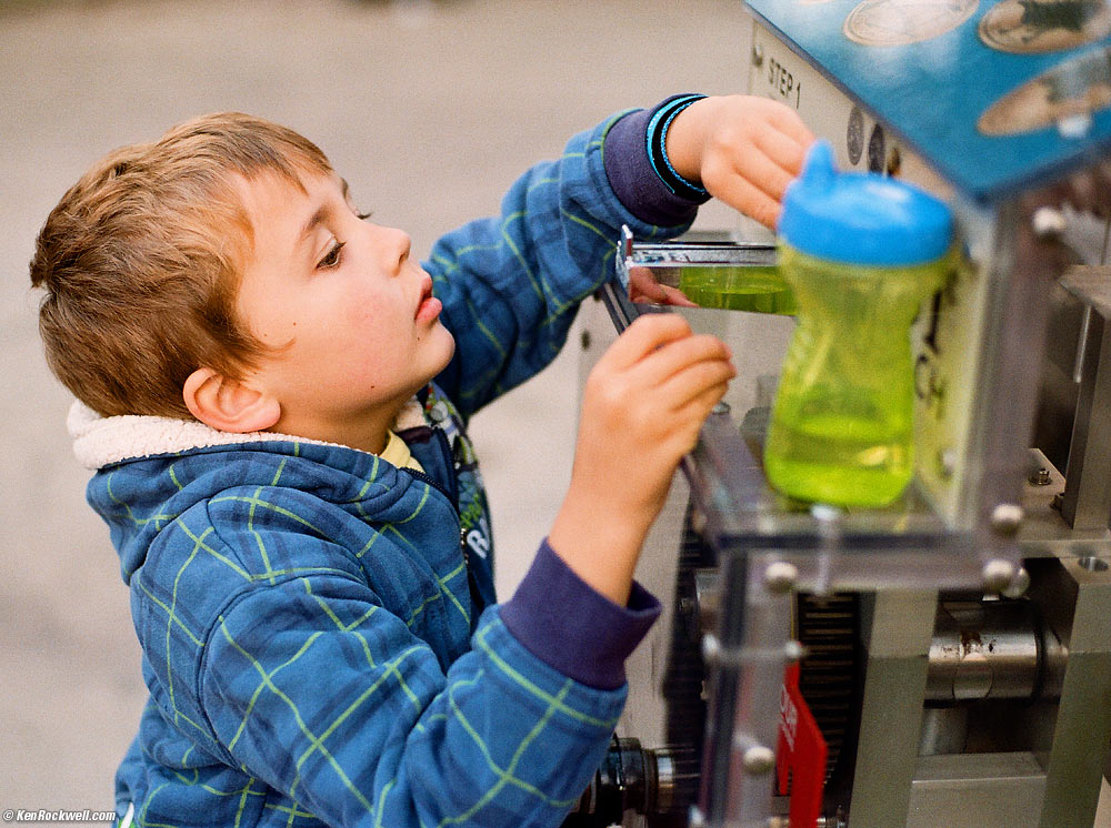 Ryan loads the penny machine.