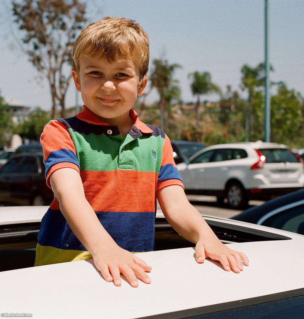 Ryan hanging out the Volvo's roof by Pei Wei.
