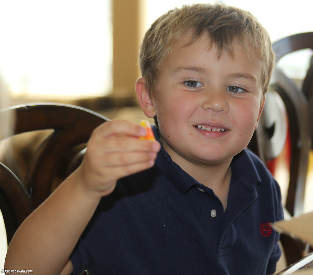Ryan is amused at the whimsical shape of an oddball candy corn
