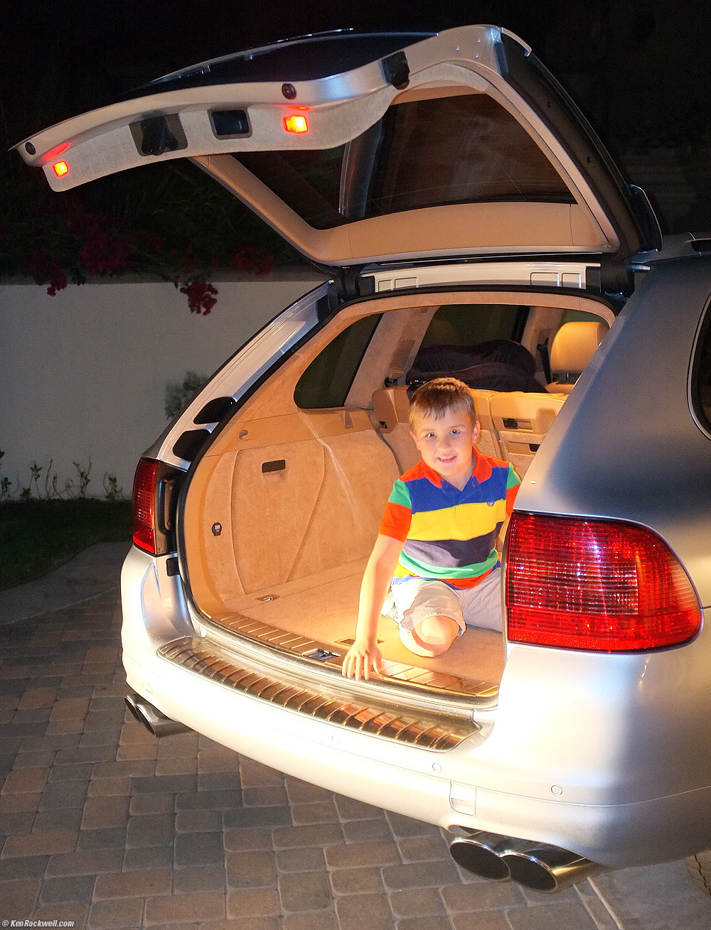 Ryan plays in the back of the Porsche Cayenne Turbo S