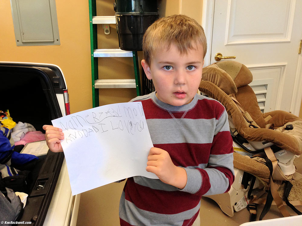 Ryan's spontaneous creation: a paper that reads: "NAME RYAN. MOM AND DAD I LOVE YOU."