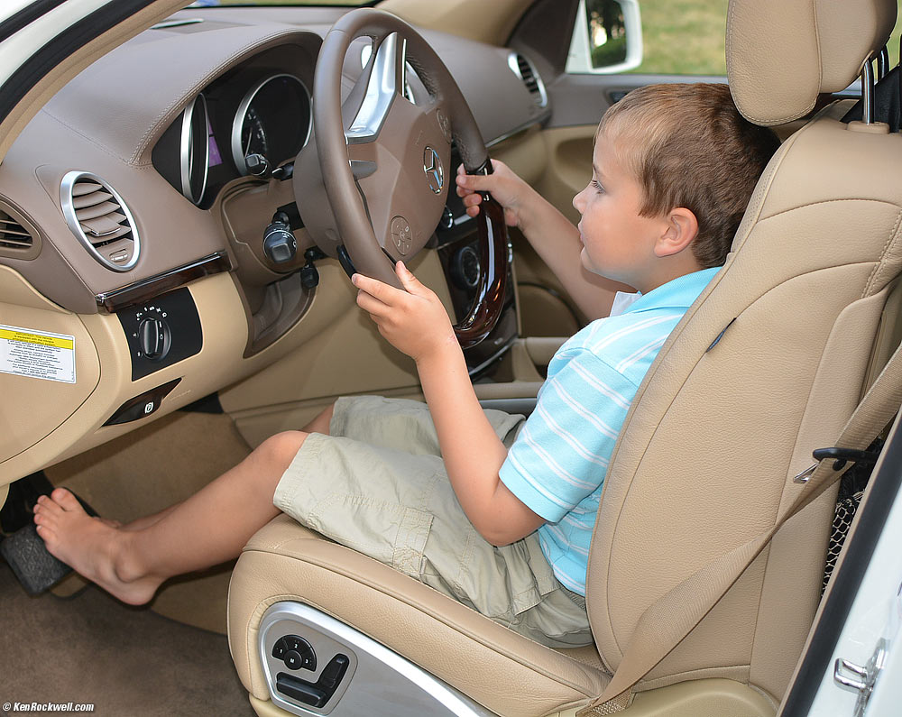Ryan adjusted the seat of Stomper, the big Mee, and now can drive it himself.