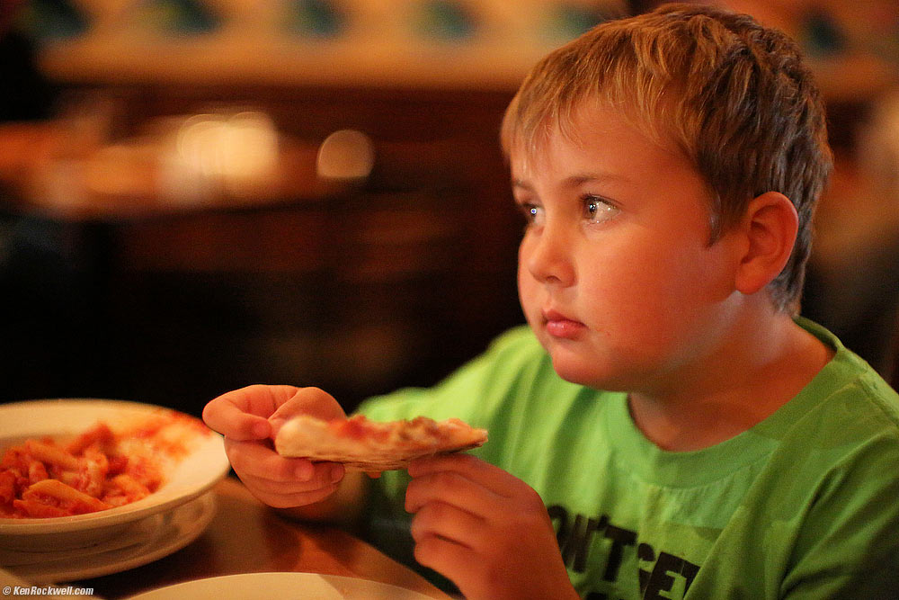 Ryan enjoys his pizza