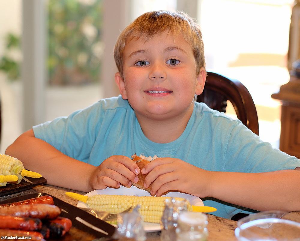 Ryan at Noni's enjoying the corn he expertly shucked
